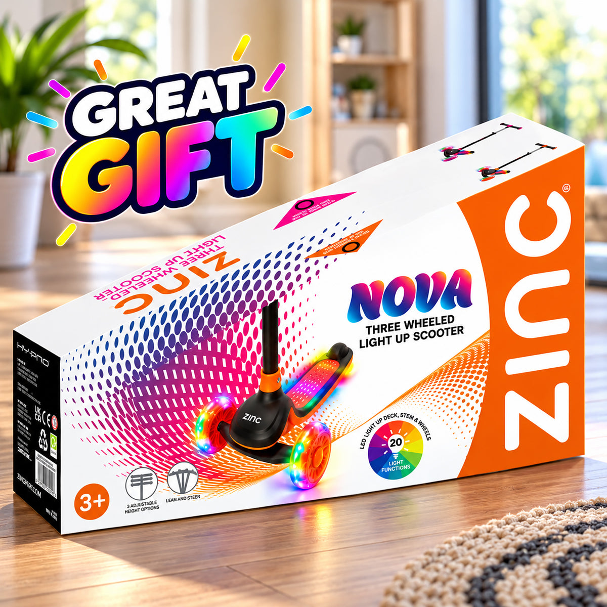 Zinc Nova Three Wheeled Light Up Scooter gift box featuring a colorful rainbow light-up scooter on the front, with a large 'GREAT GIFT' promotional badge in the top left and a blurred indoor room background.