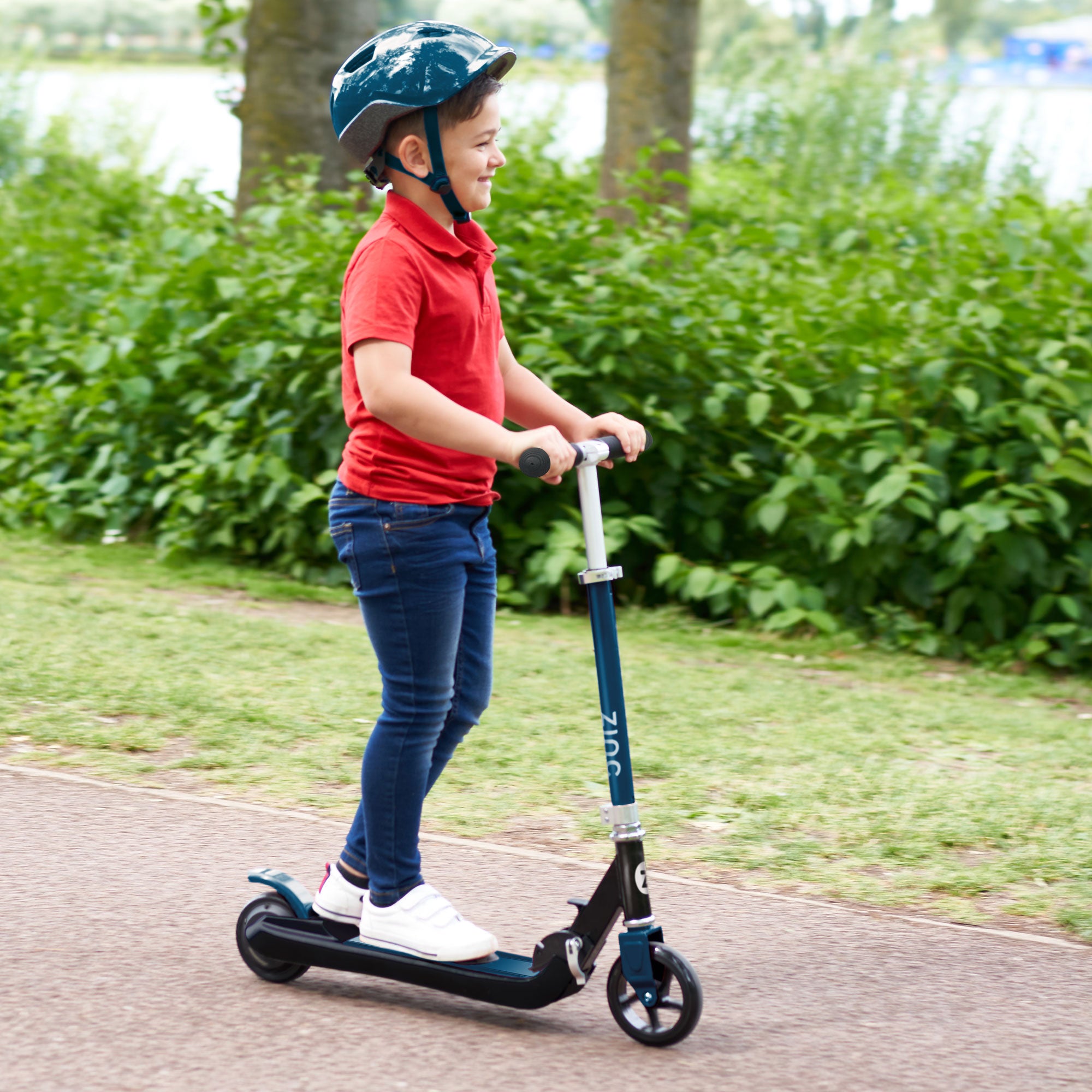 Lightweight 4.82kg electric scooter showing easy grip handles and rear footbrake for safe stopping