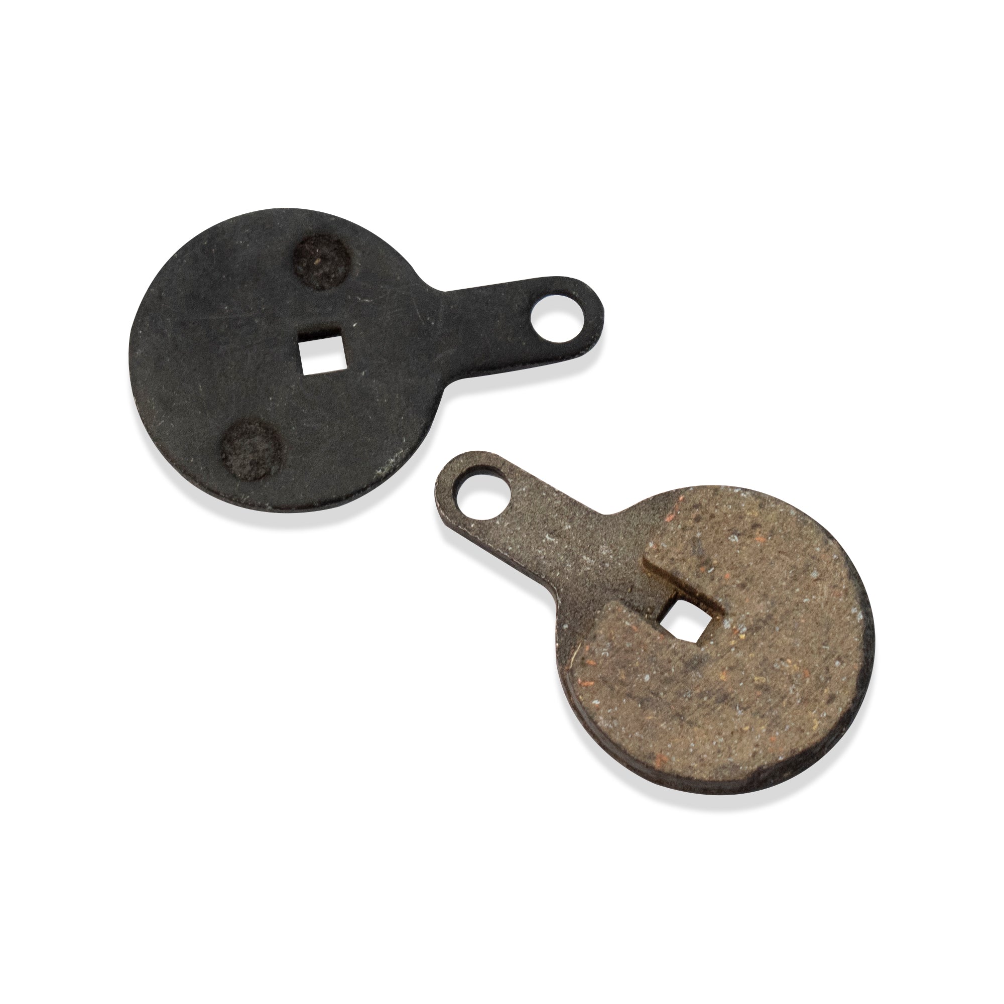 Two replacement disc brake pads for electric scooters, one showing the front metal surface and the other the worn-out back side.