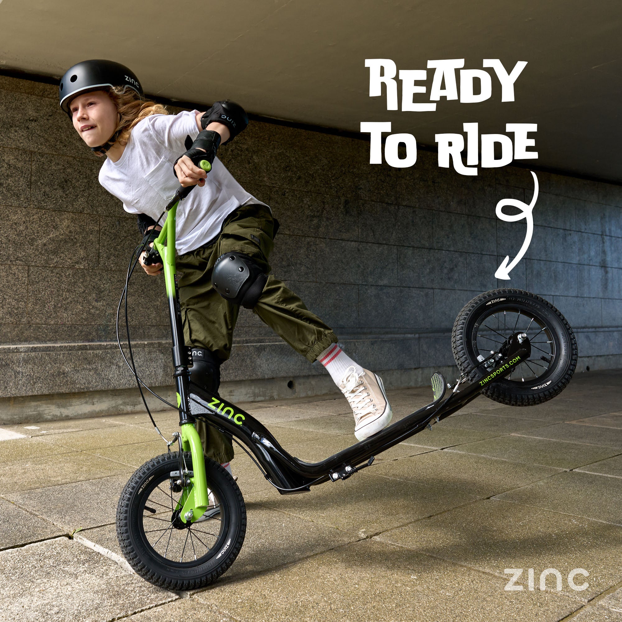 Ready to ride green radkal bmx scooter in use