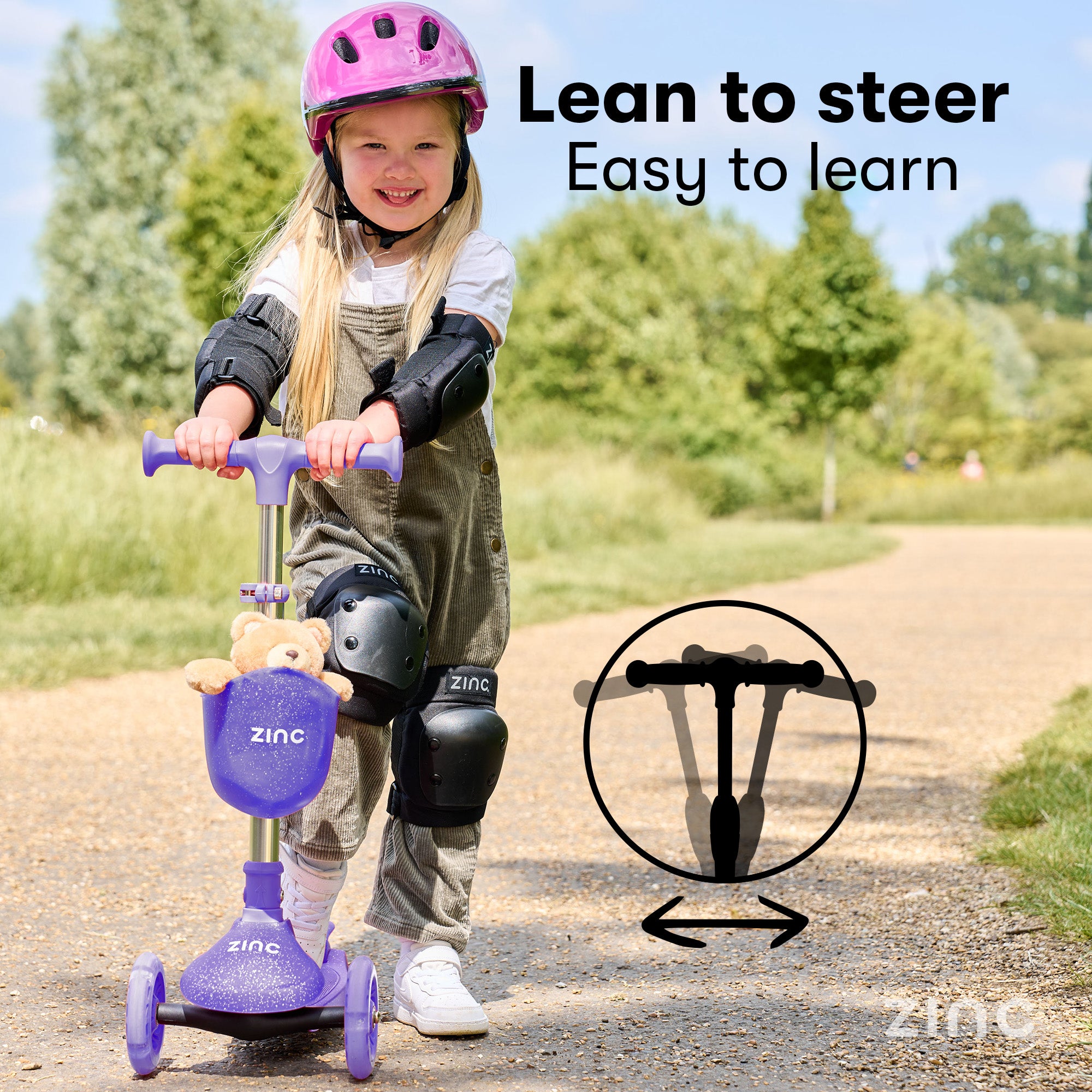 Child riding a scooter with protective gear, leaning to steer feature highlighted, outdoors.