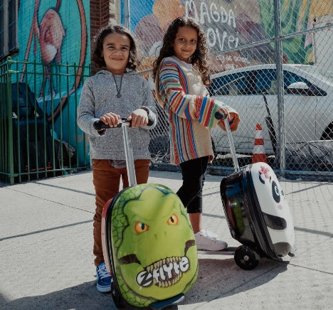 Flyte scooter suitcases in the Dinosaur and Panda design.