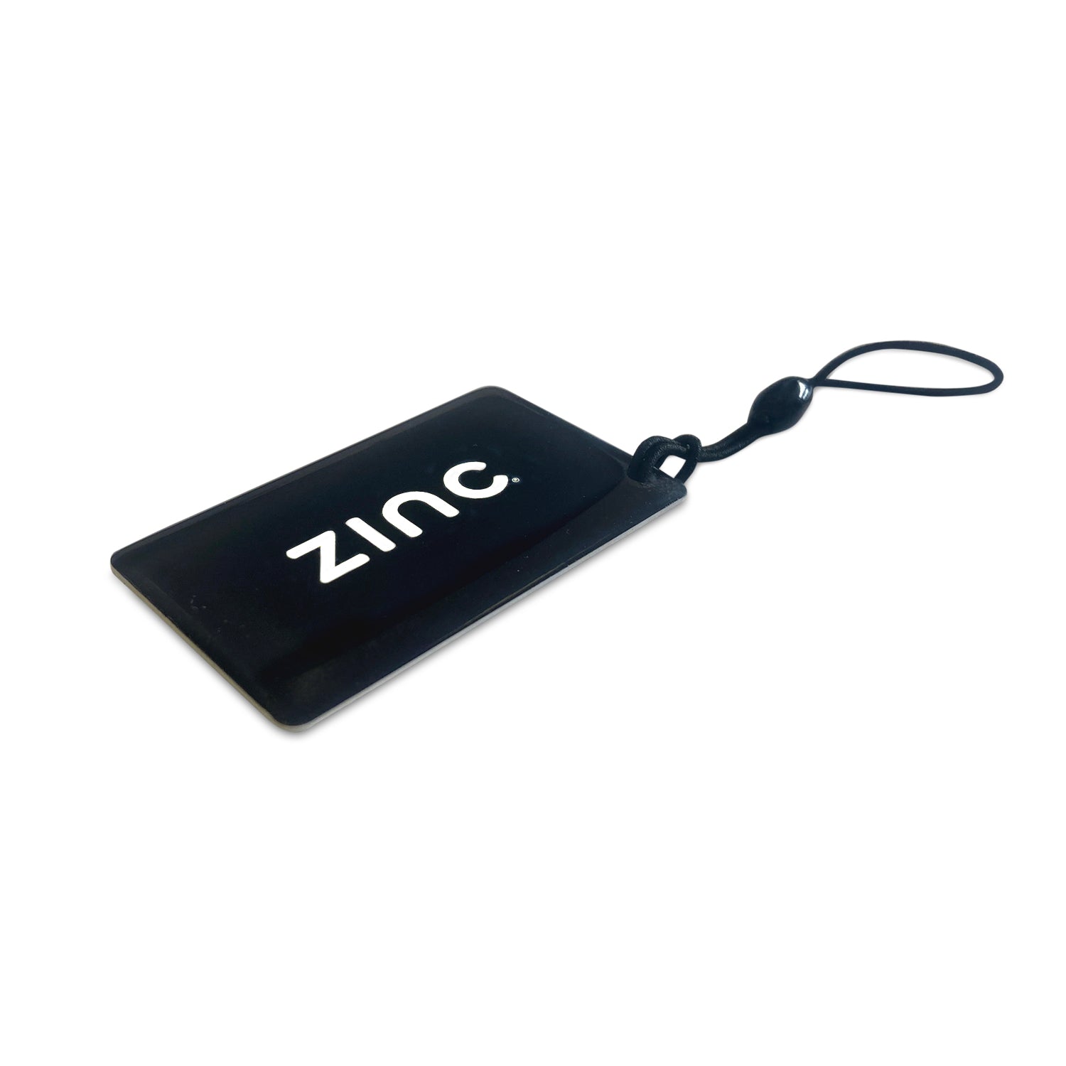 A black NFC card key fob with the brand name 'Zinc' printed on it, attached to a black strap.