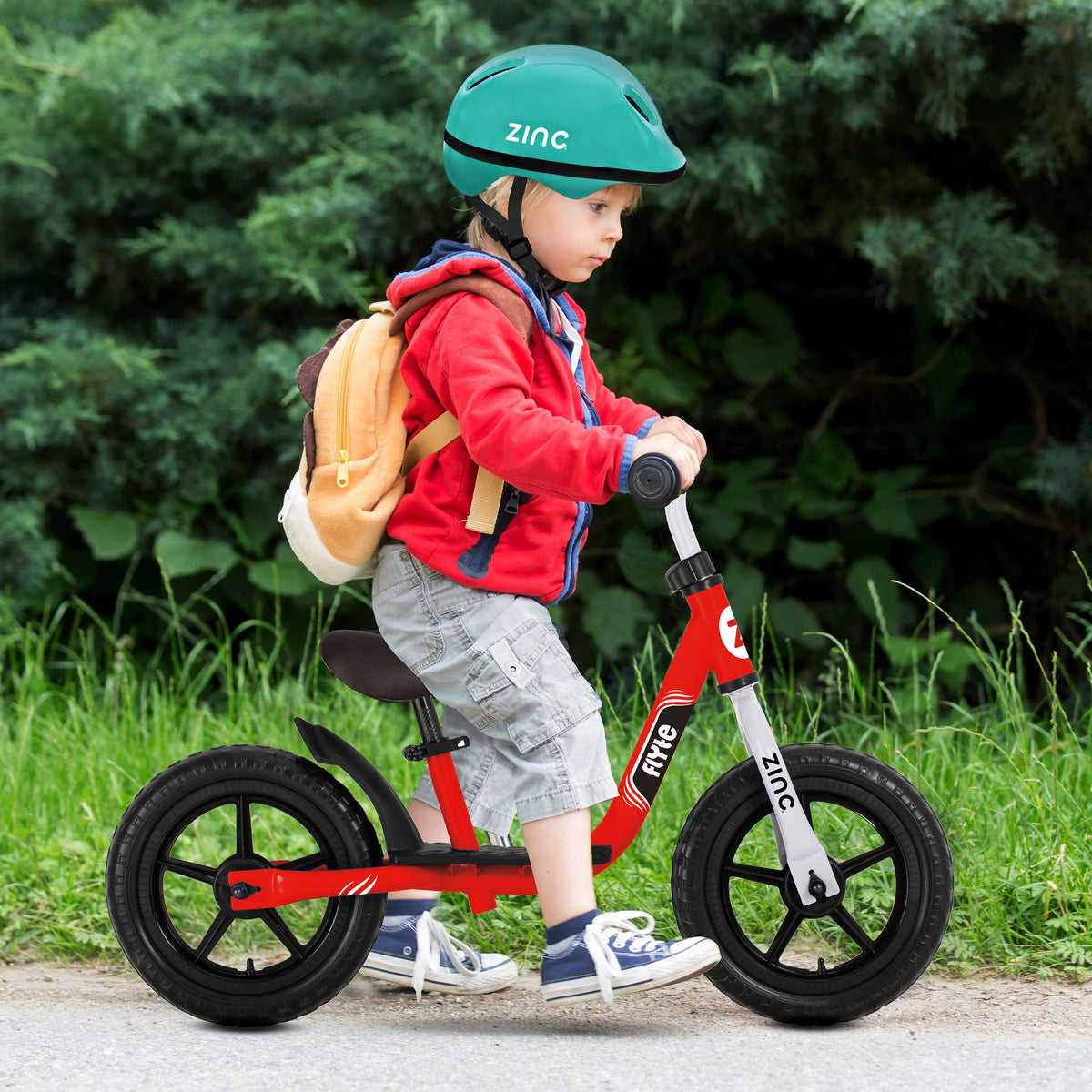 Zinc Flyte Dash Balance Bike Lifestyle - Boy with Green Helmet Developing Confidence and Balance Skills