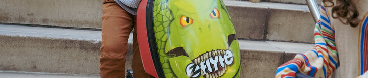 Close up of the Darwin the Dinosaur Flyte Scooter Suitcase.