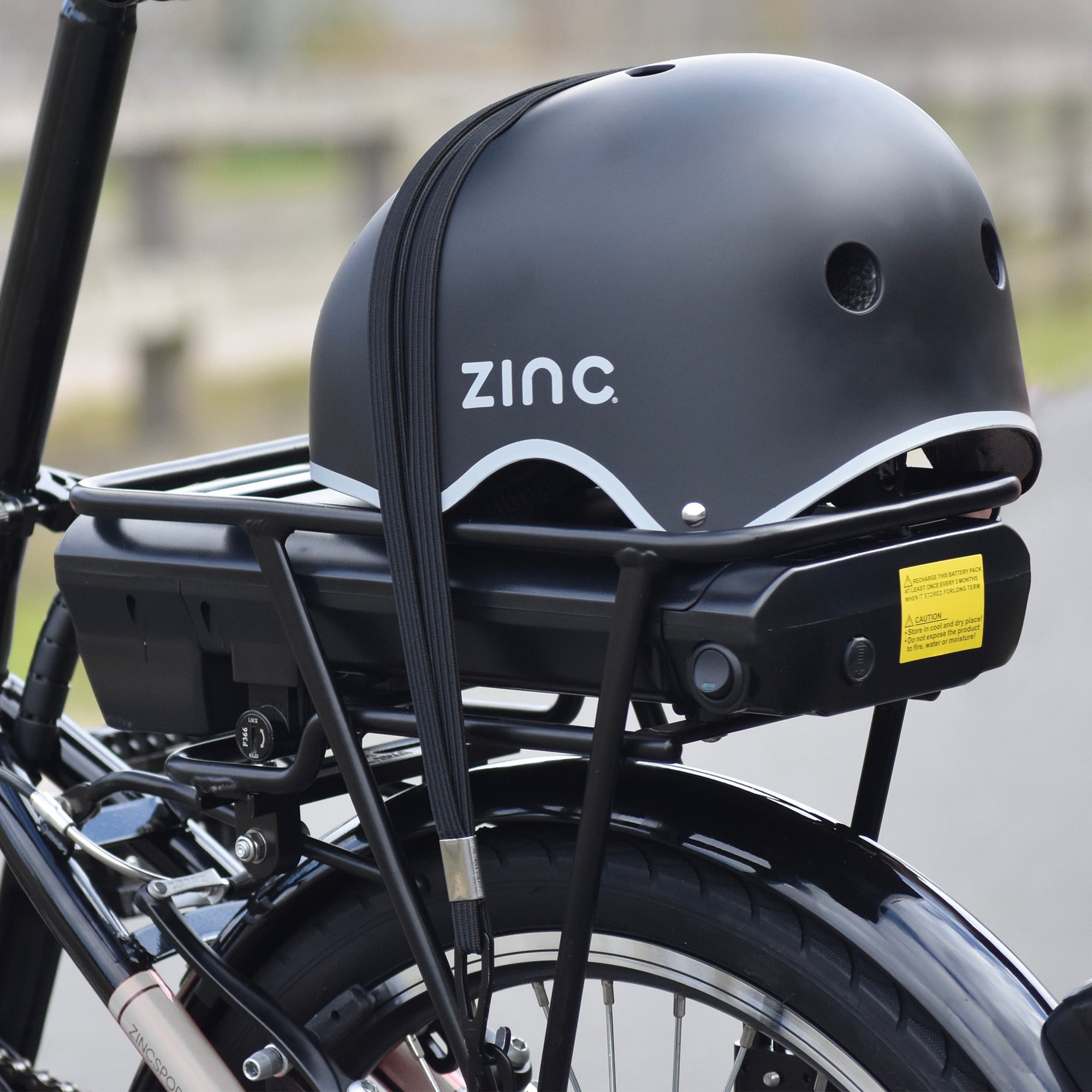 Quick-fold mechanism with securing straps on electric bike for hassle-free folding and transport