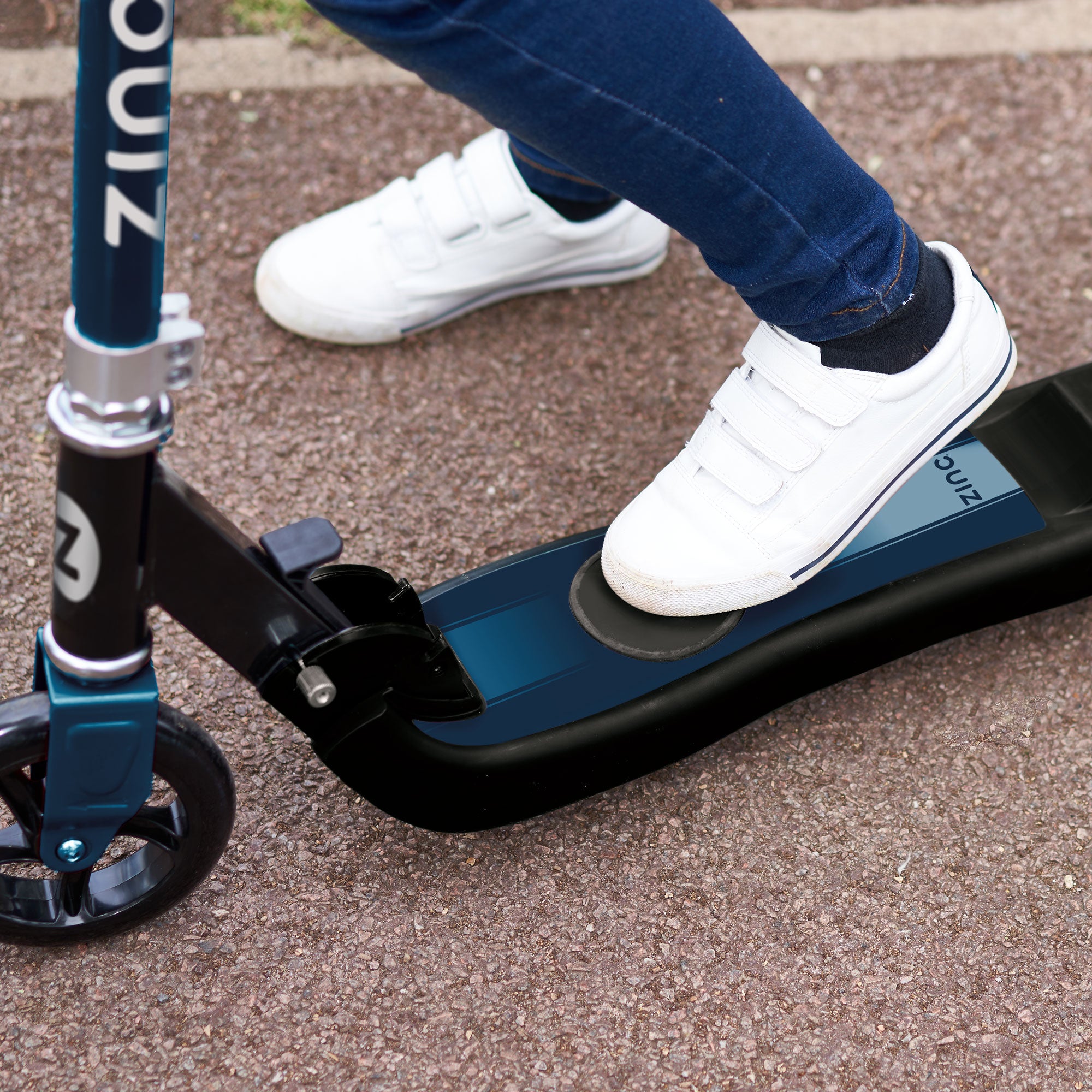 Electric scooter showing anti-slip footplate and foot pad throttle activation for safe 5mph riding