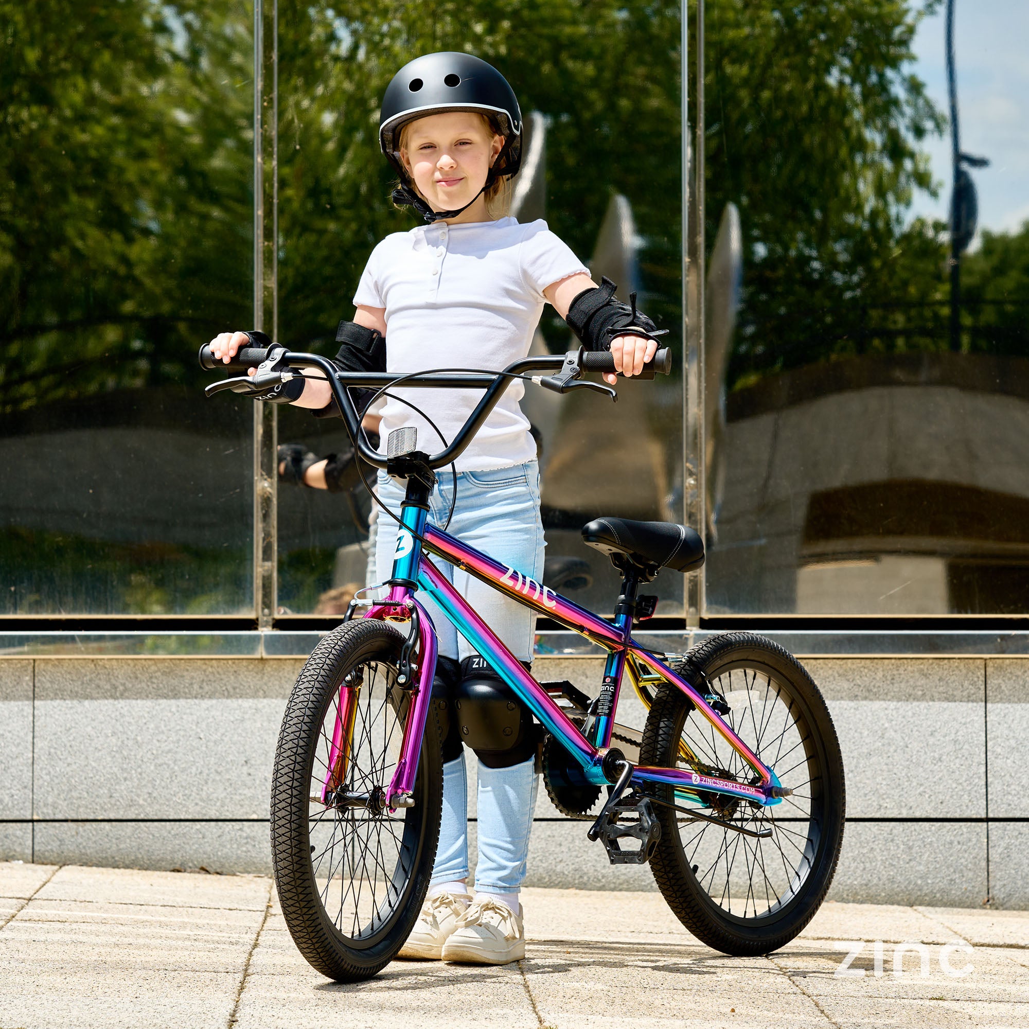 Girl Riding Zinc Neochrome 20inch BMX Bike - Safety Helmet and Protective Pads for Freestyle BMX
