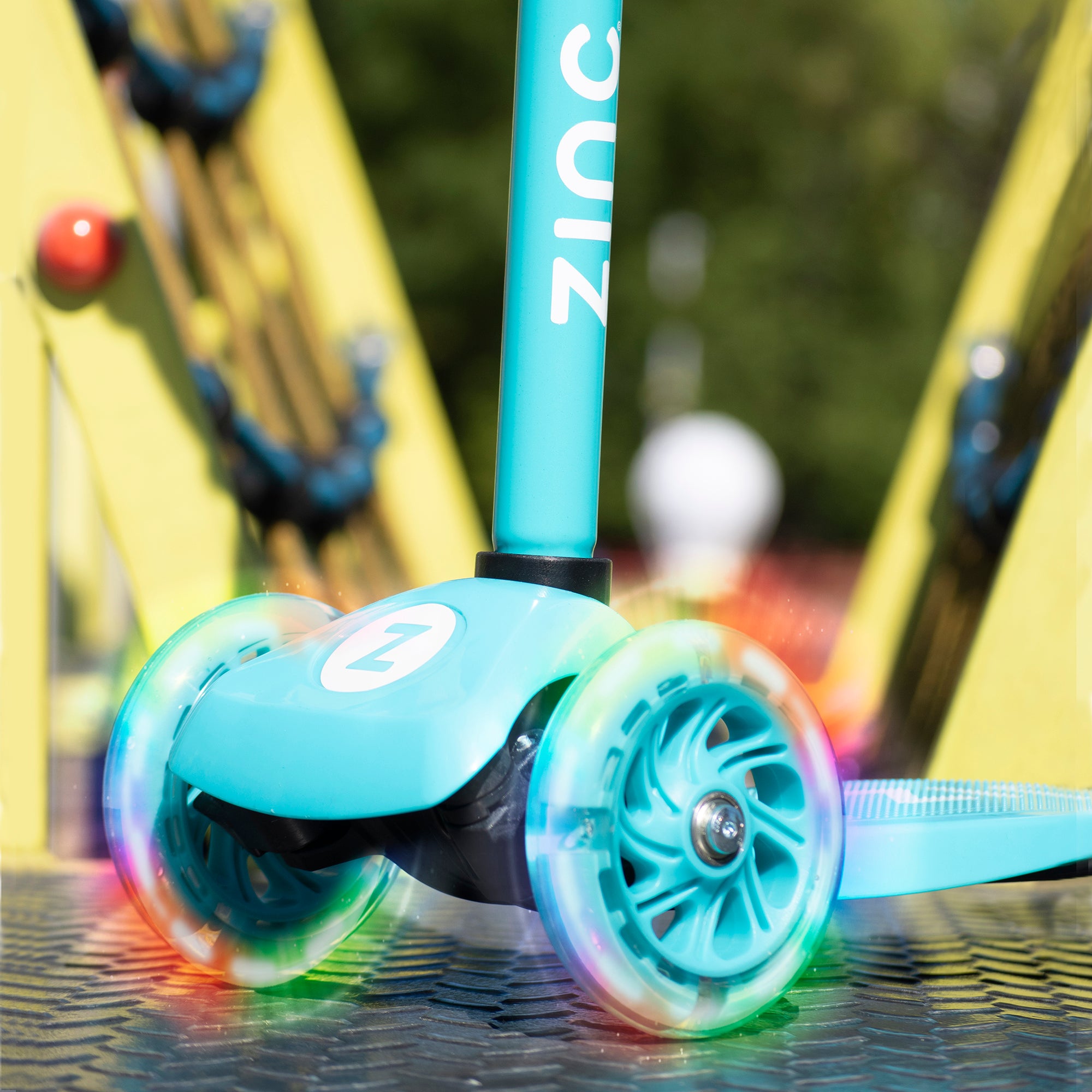 Zinc Three Wheeled Light Up Star Scooter blue- close-up detail of light-up wheels 