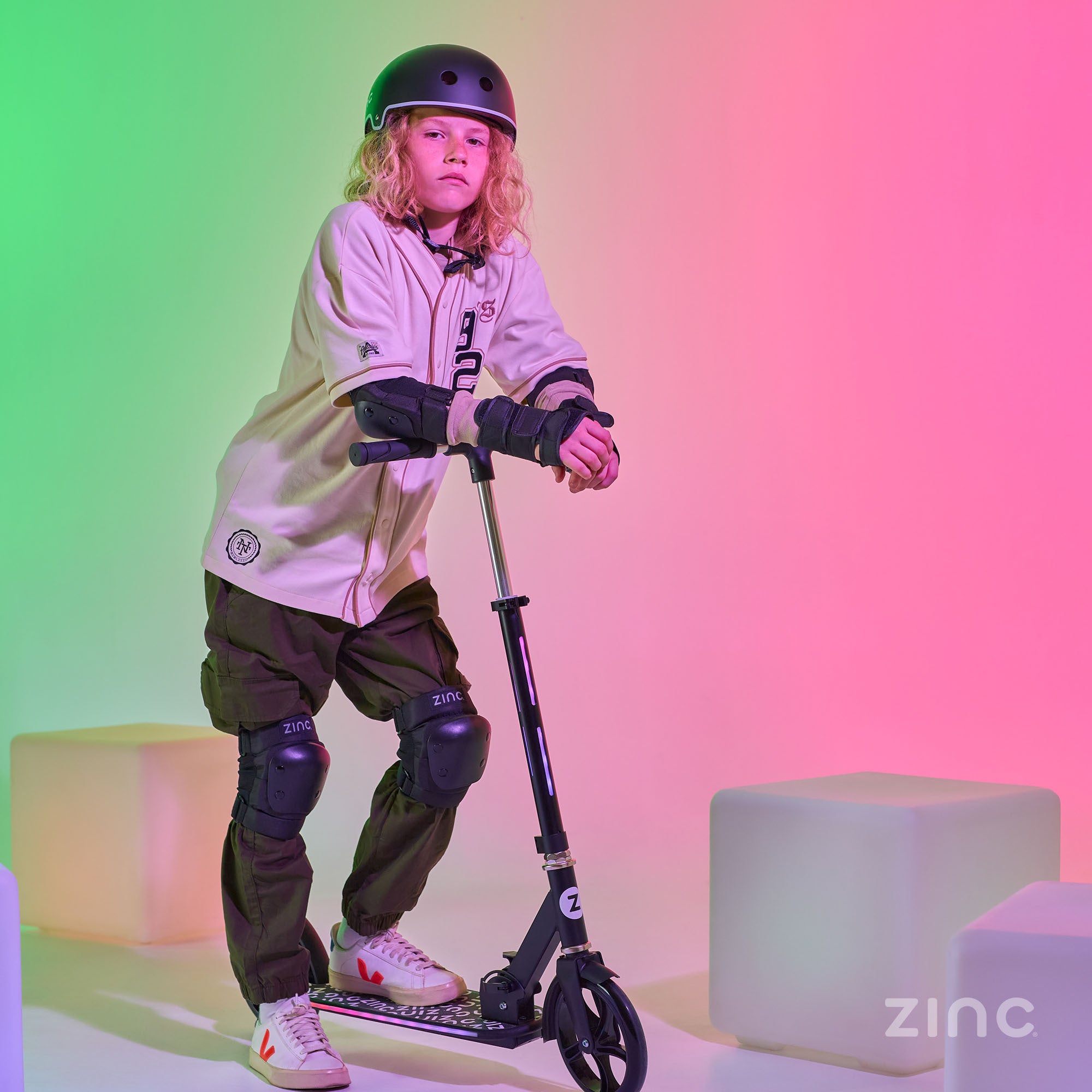 oy with Zinc Brillz Light Up Big Wheeled Folding Scooter in Illuminated Studio