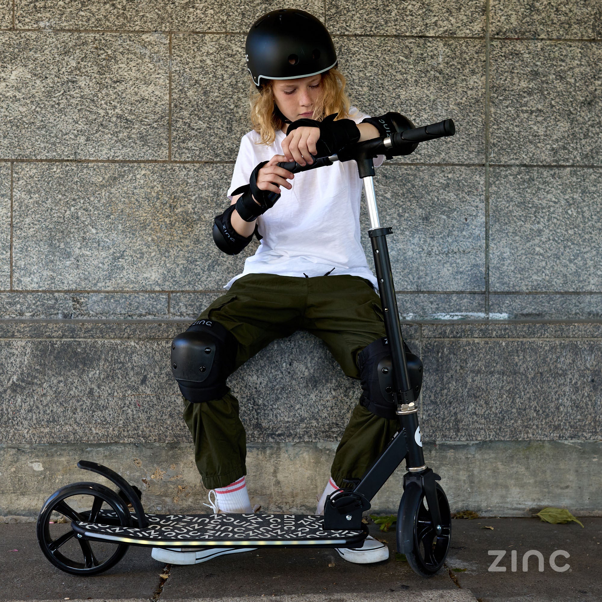 Boy with Zinc Brillz Light Up Big Wheeled Folding Scooter - Lifestyle Product Shot