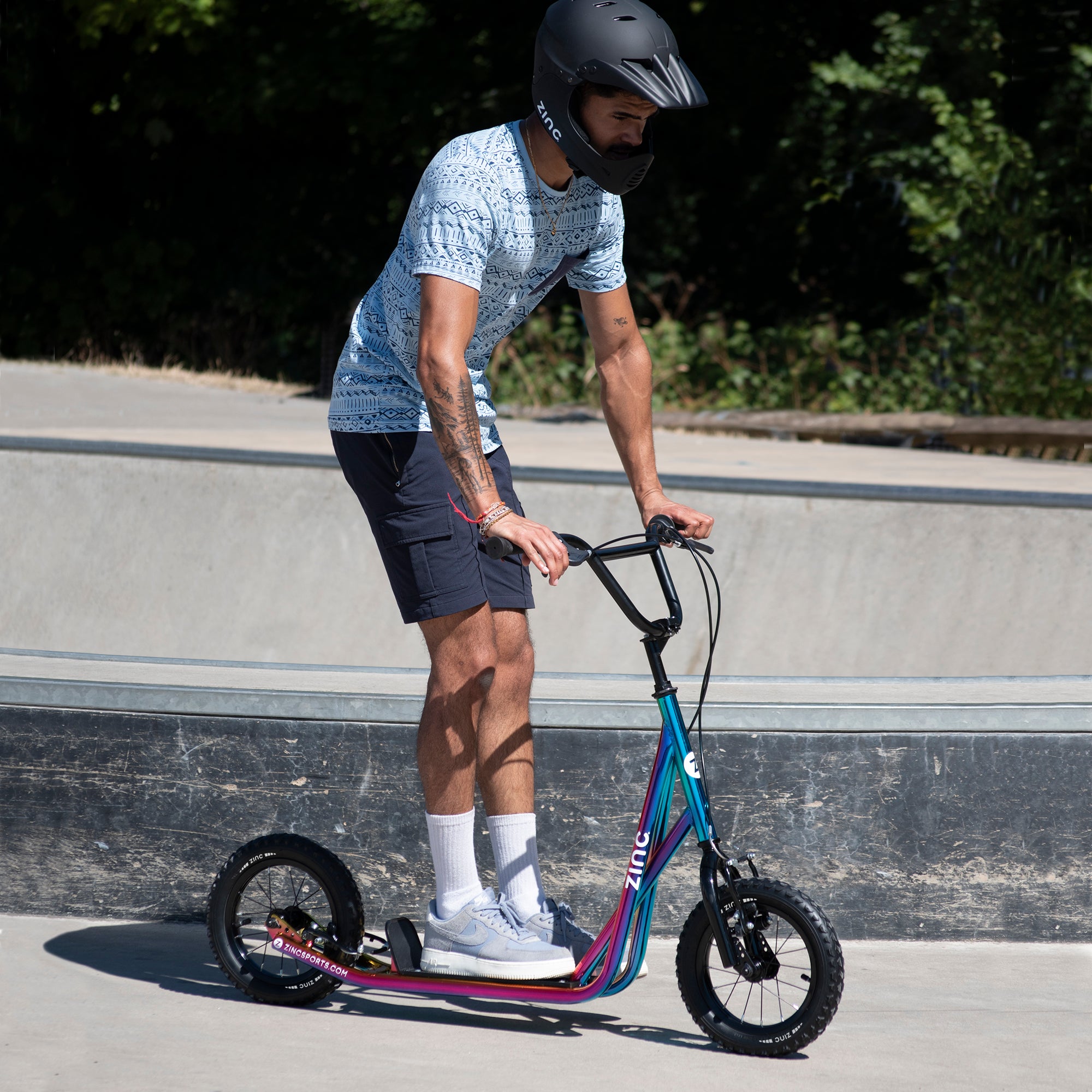 Child enjoying Zinc BMX Scooter Neochrome Multi-colour at Skate Park - Active Lifestyle