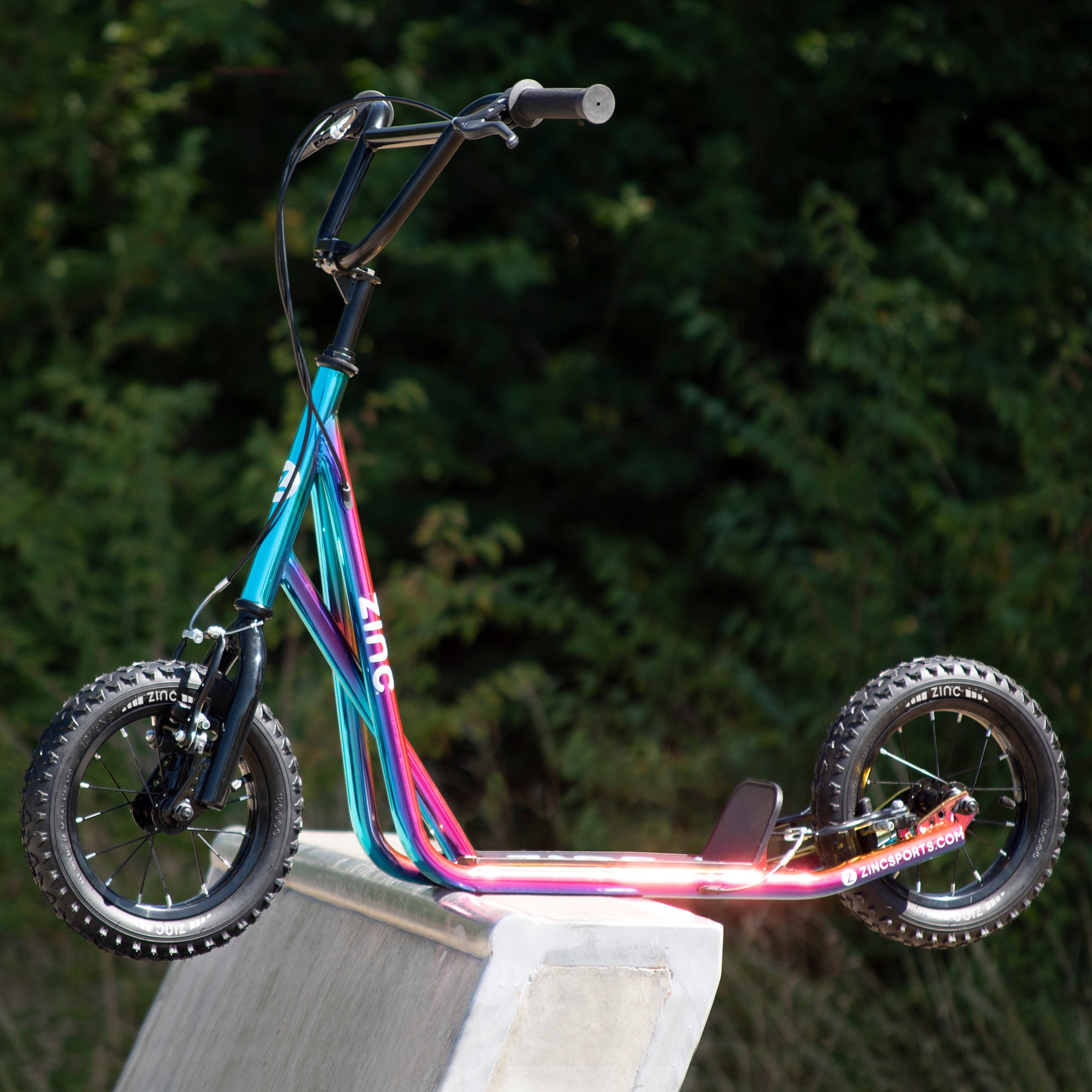 inc 12 Inch BMX Scooter Neochrome Multi-colour on Skate Park Edge - Ready for Action