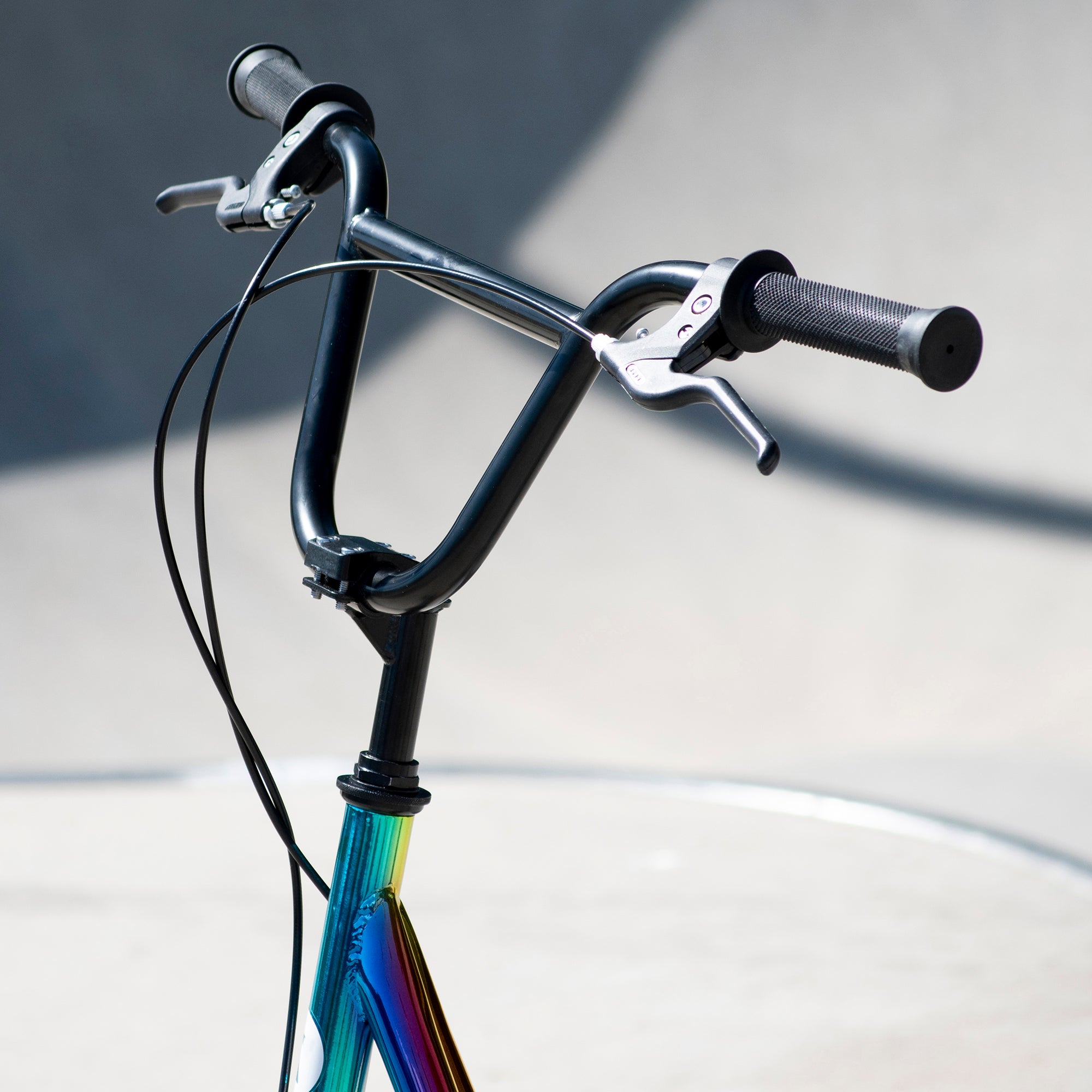 Zinc 12 Inch BMX Scooter Neochrome Multi-colour - Handlebar and Brake System Close-up