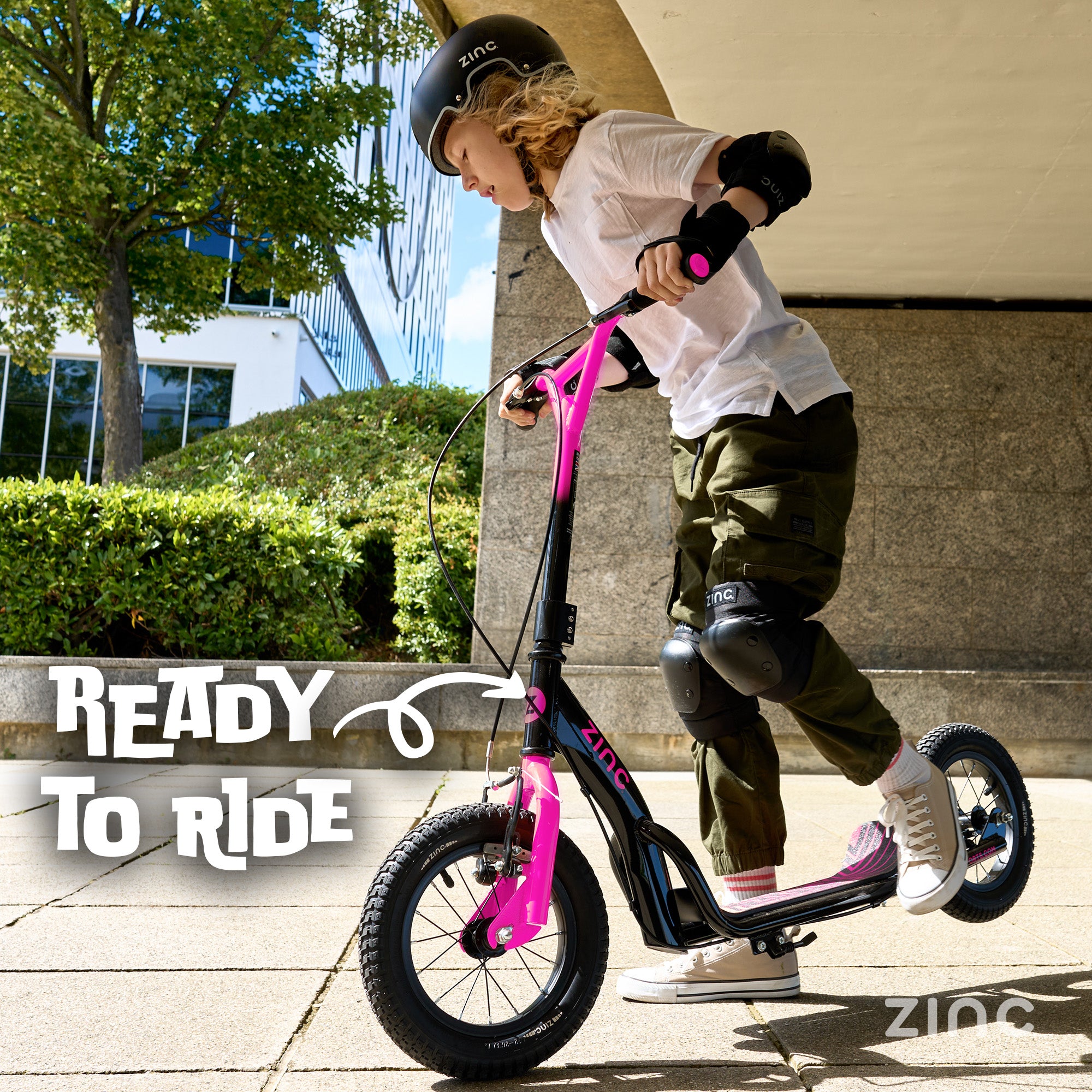 Child on a scooter with 'Ready to Ride' text and 'Zinc' branding.