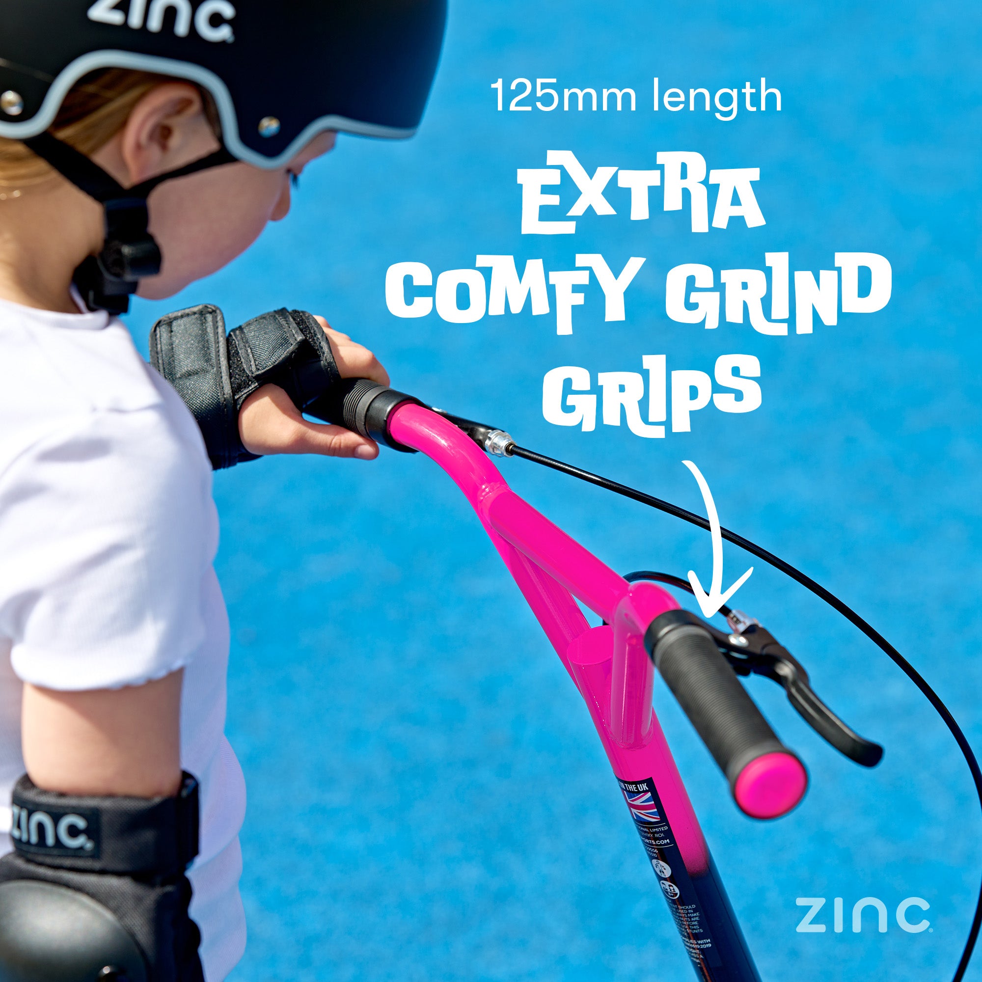 Child holding a pink scooter with text about 'Extra Comfy Grind Grips' on a blue background