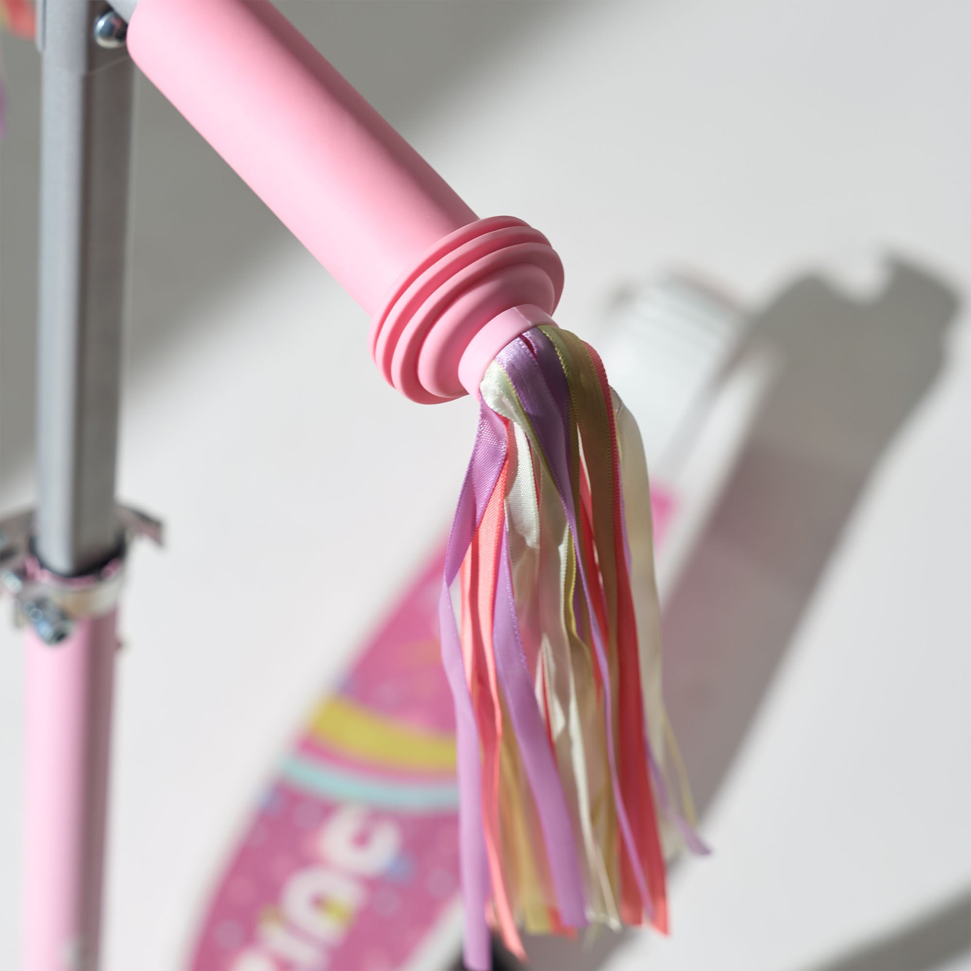 Unicorn-themed electric scooter for kids featuring enchanting design with tassels