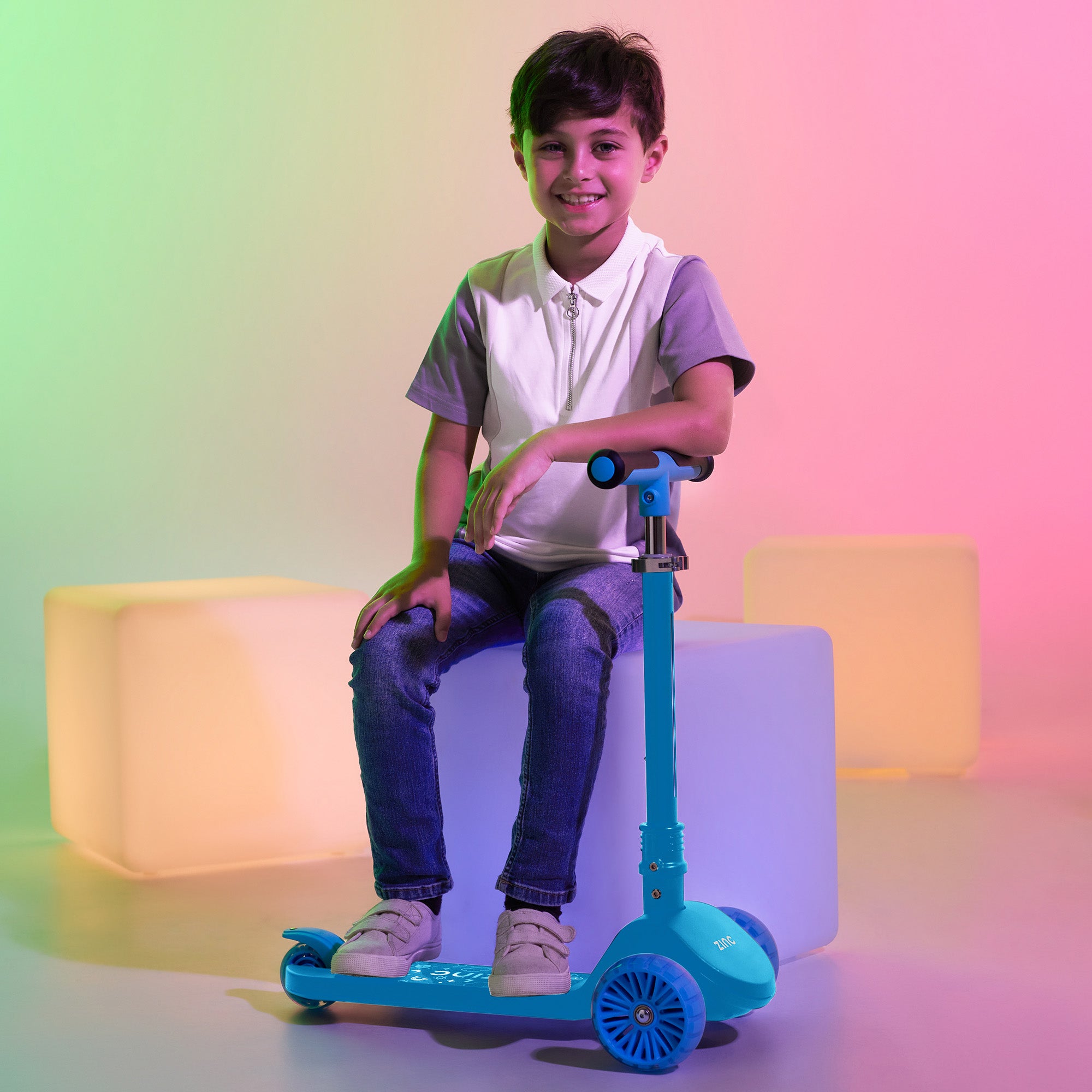 Zinc T-Motion Shine scooter in blue inside studio shoot