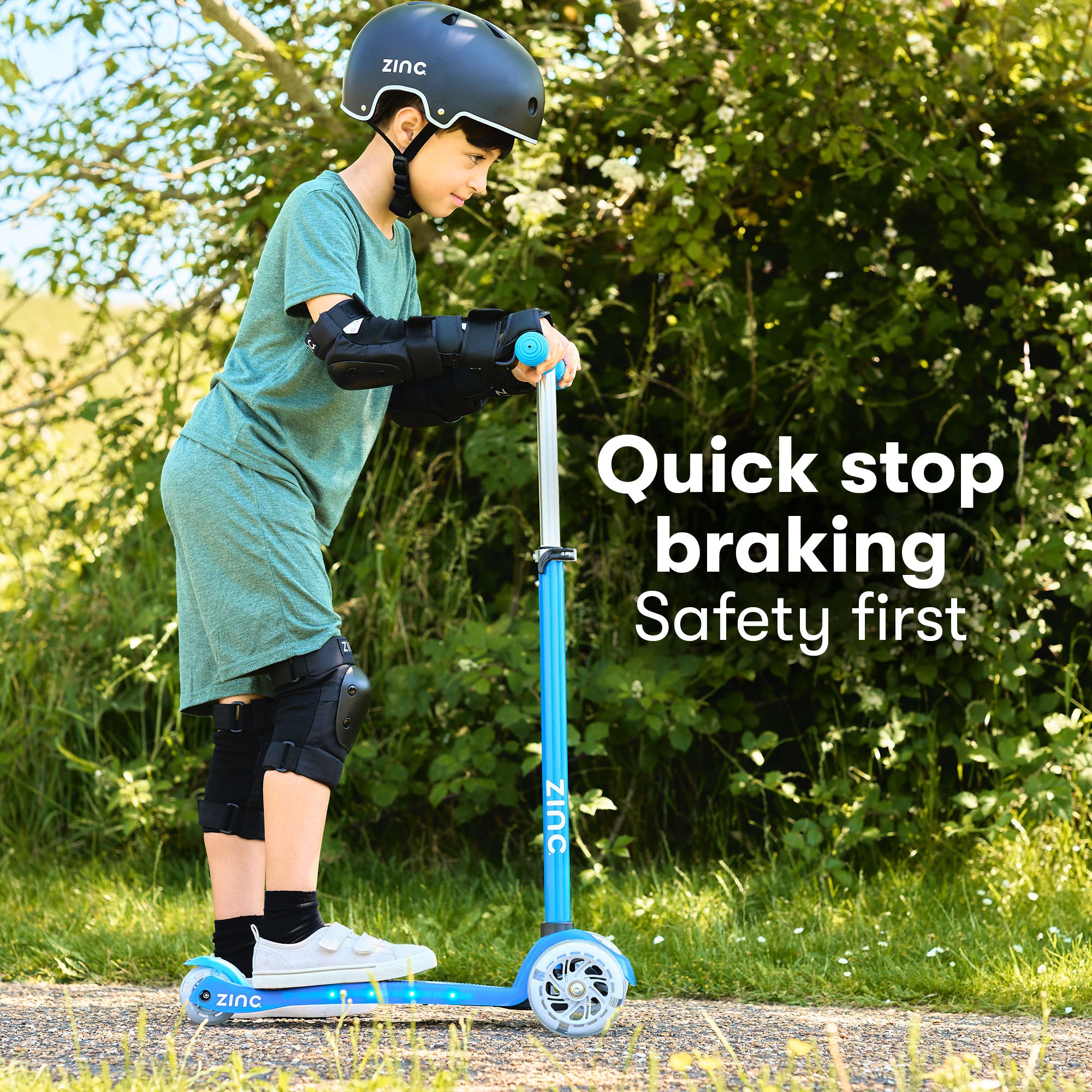 Boy on Zinc 3 wheel scooter showing safety features of the superstar