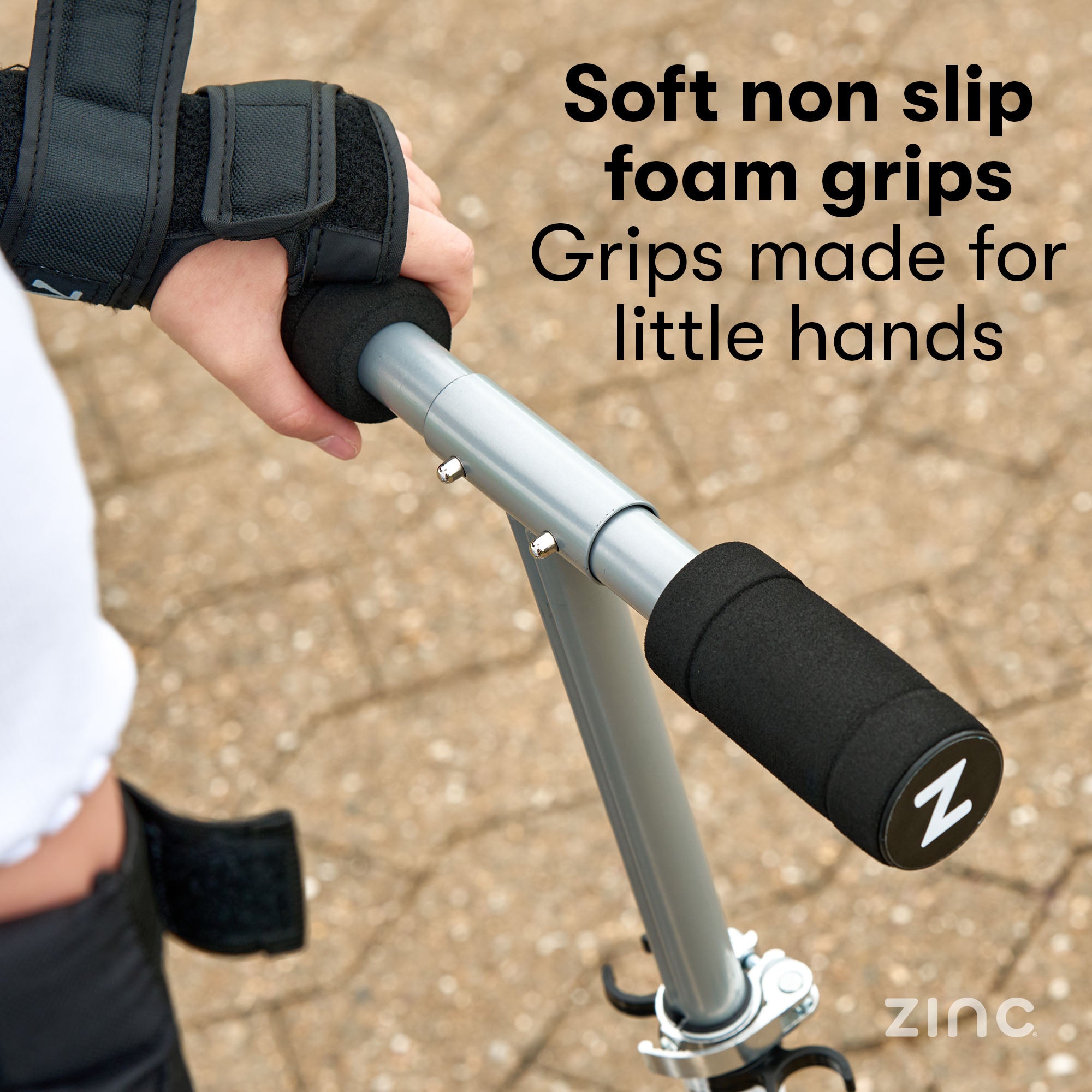 Zinc Rider folding scooter featuring soft touch foam grips providing comfortable handlebar control for extended riding