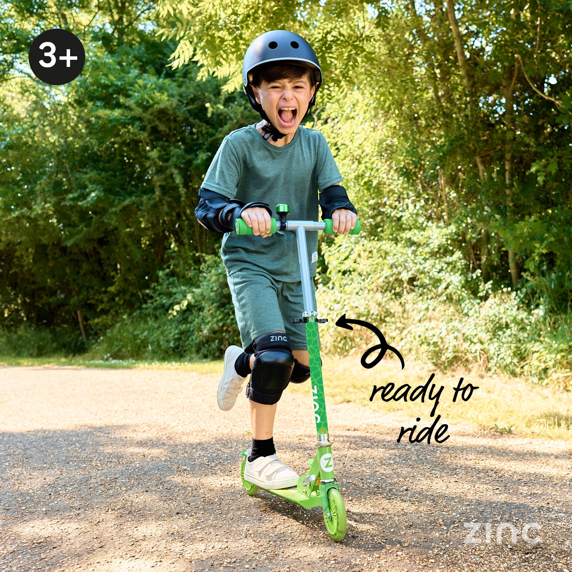 Child riding Zinc Dino scooter with light up wheels perfect for children switching to two wheels