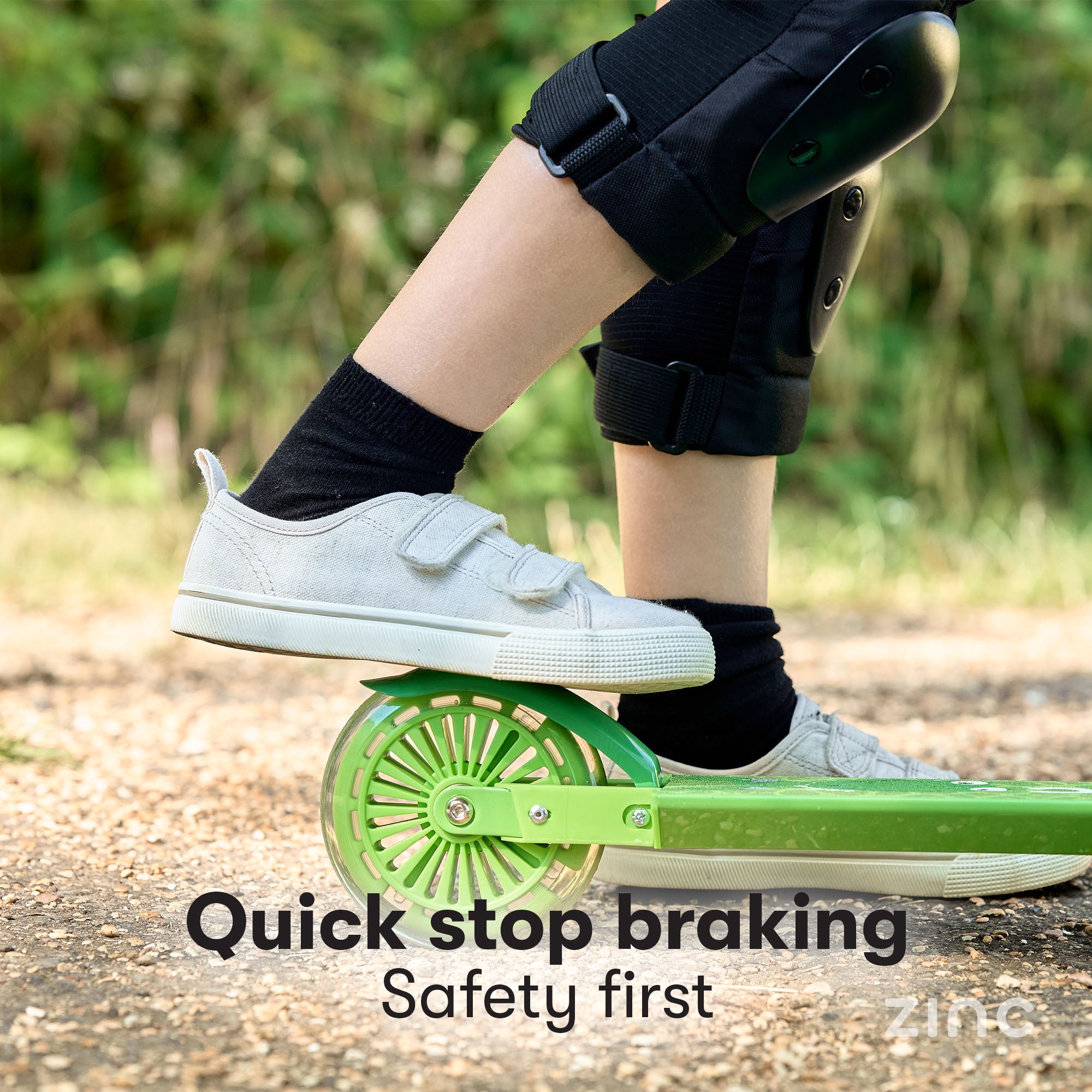 Child demonstrating precision braking on Zinc Dino scooter using easy-to-use rear footbrake for controlled stopping