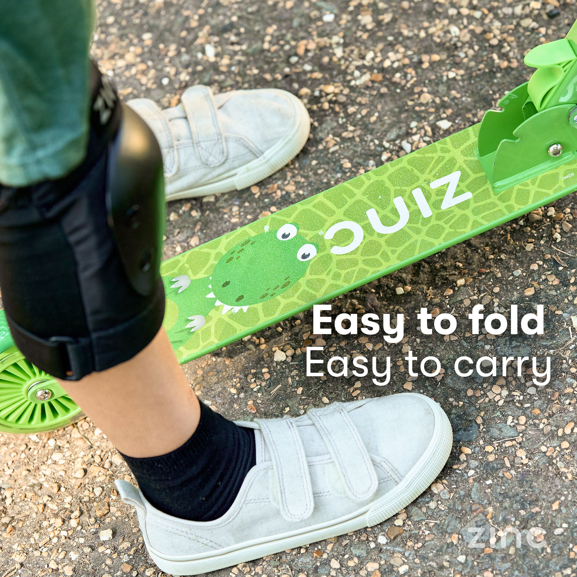 Anti-slip footplate on dinosaur themed scooter providing secure footing and stability for safe riding