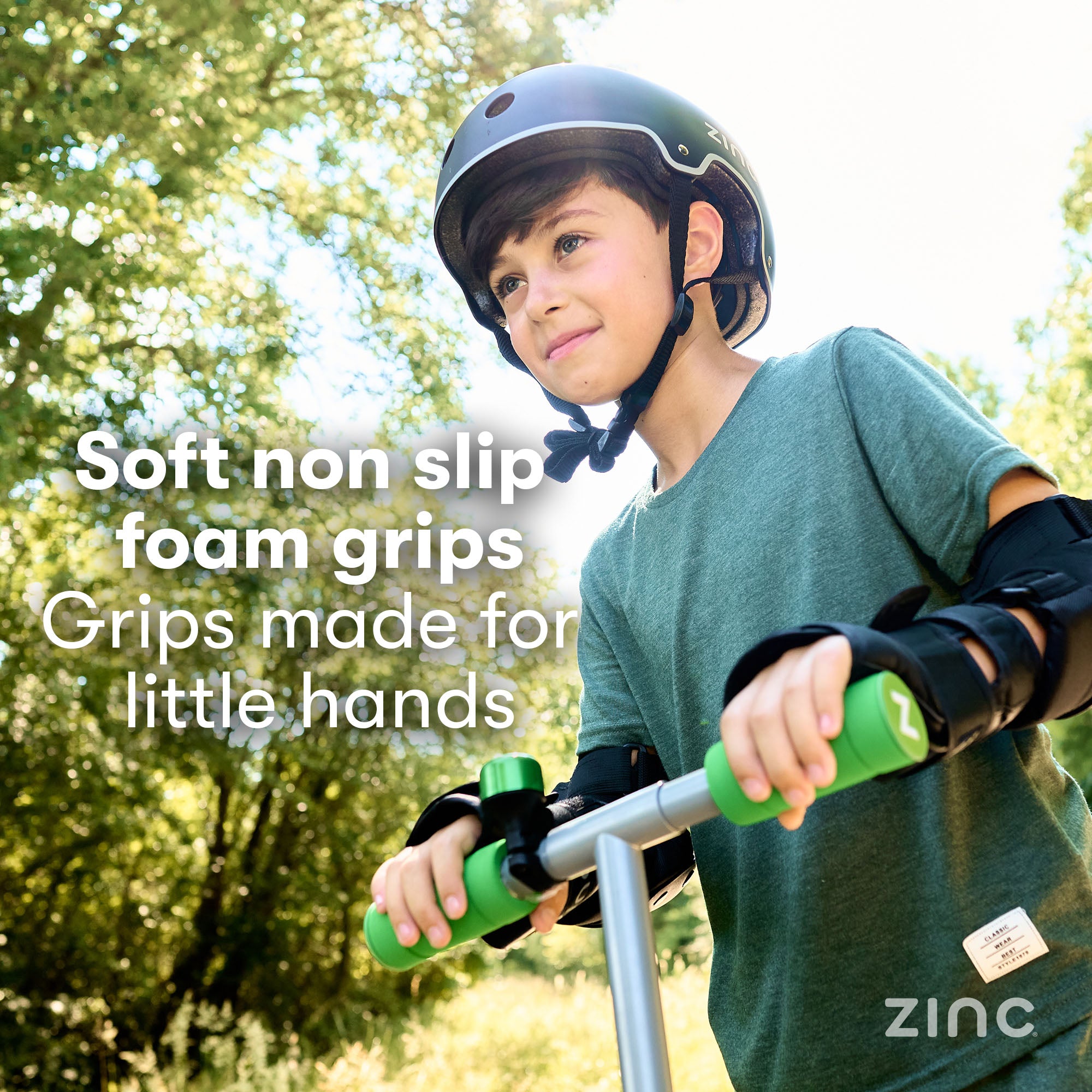 Happy child holding soft grip handles on Zinc Dino scooter showing comfortable riding experience and joy
