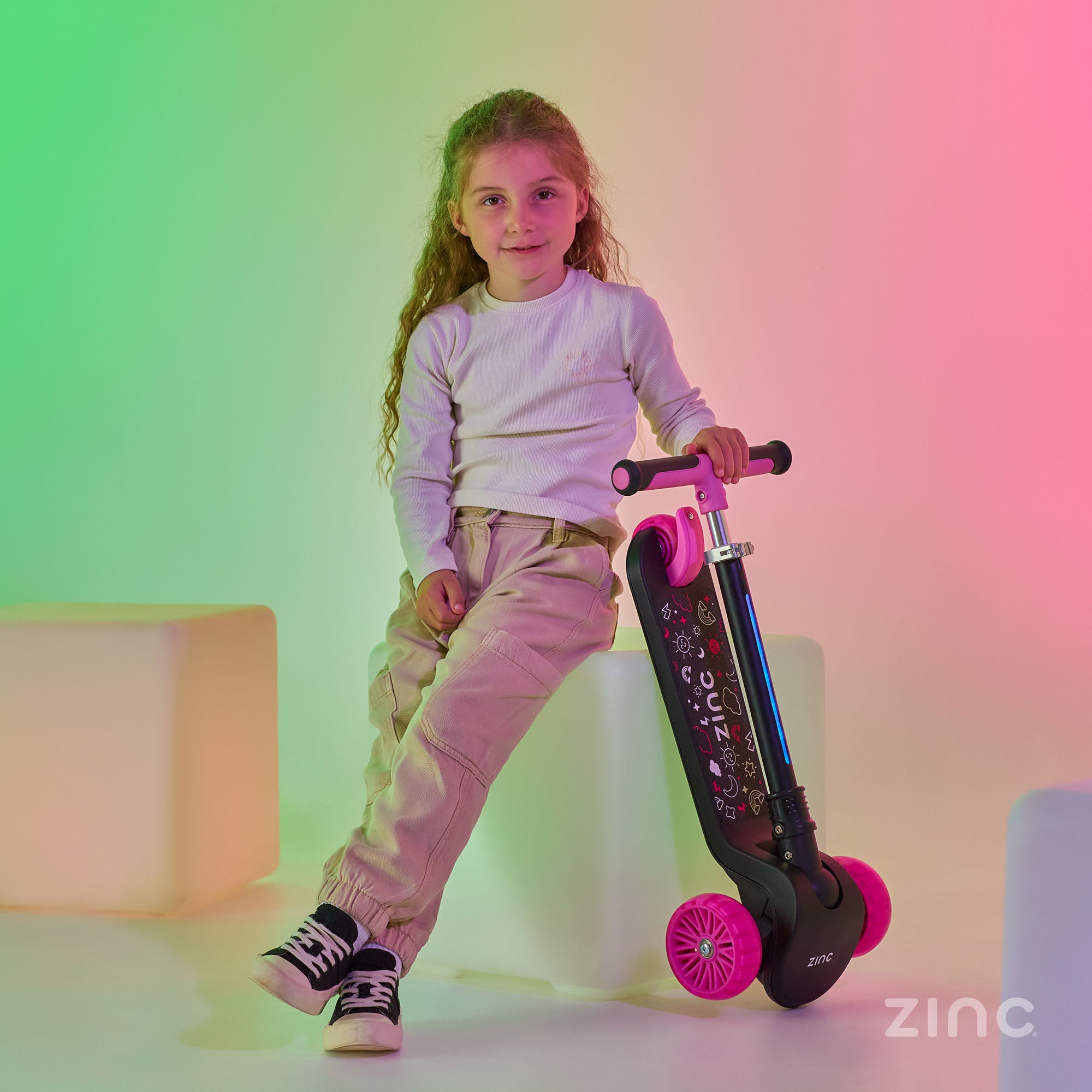 Black and pink T-Motion Shine scooter demonstrating portability