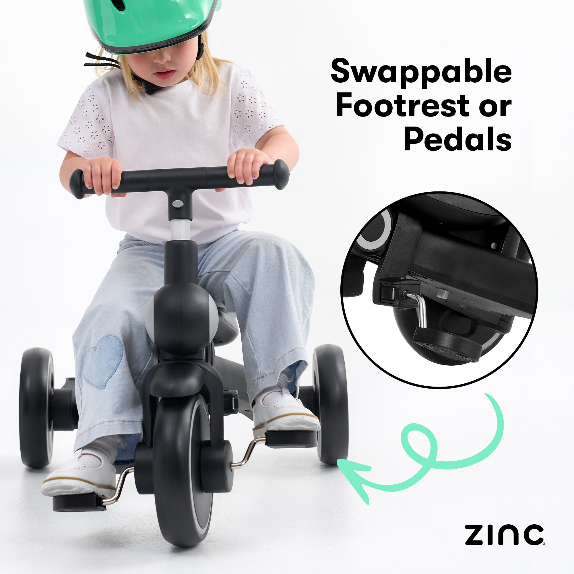 Child riding a tricycle with swappable footrest or pedals feature, highlighting the 'Zinc' brand.