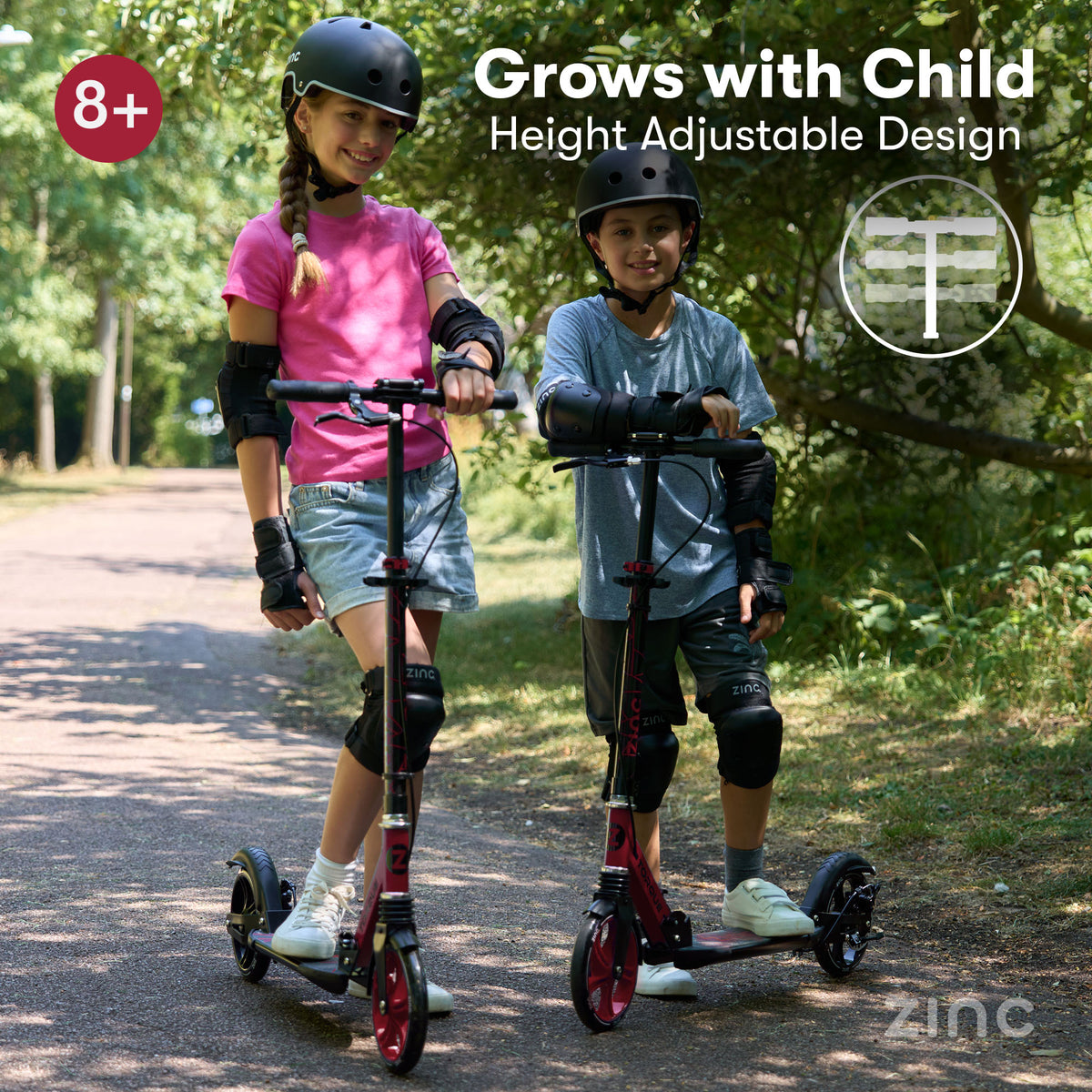 Two children wearing helmets and protective pads ride red and black big wheel kick scooters on a tree-lined path. Text overlays read 'Grows with Child Height Adjustable Design' and '8+' with a zinc logo in the corner.