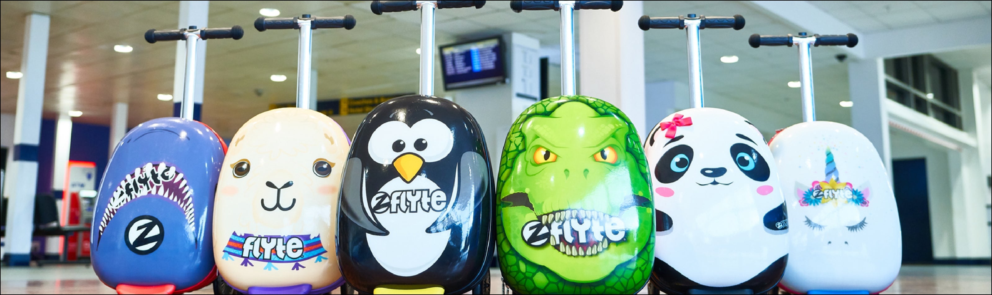 Zinc Flyte scooter suitcase designs lined up in an airport. Featuring Penguin, shark, dinosaur, panda and unicorn.