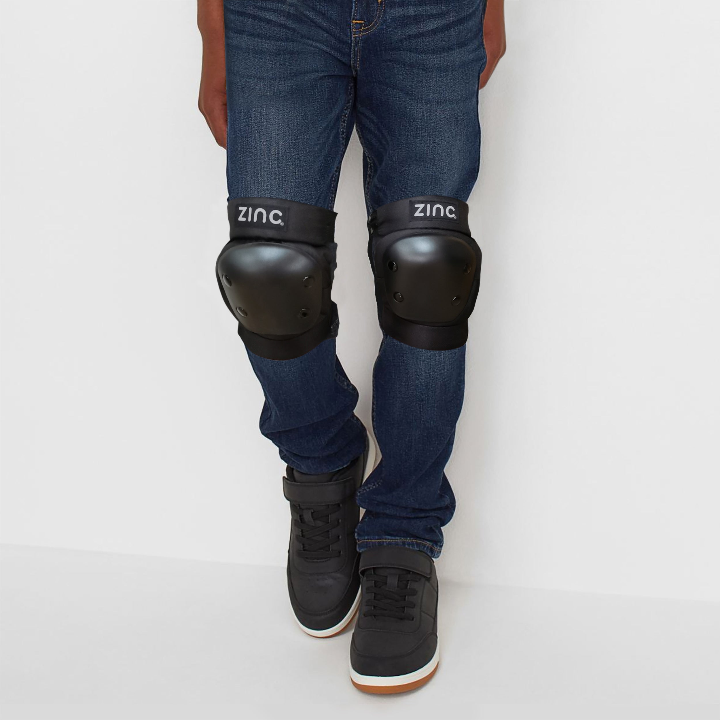 Zinc Pro Pad Set knee pads being worn over blue jeans
