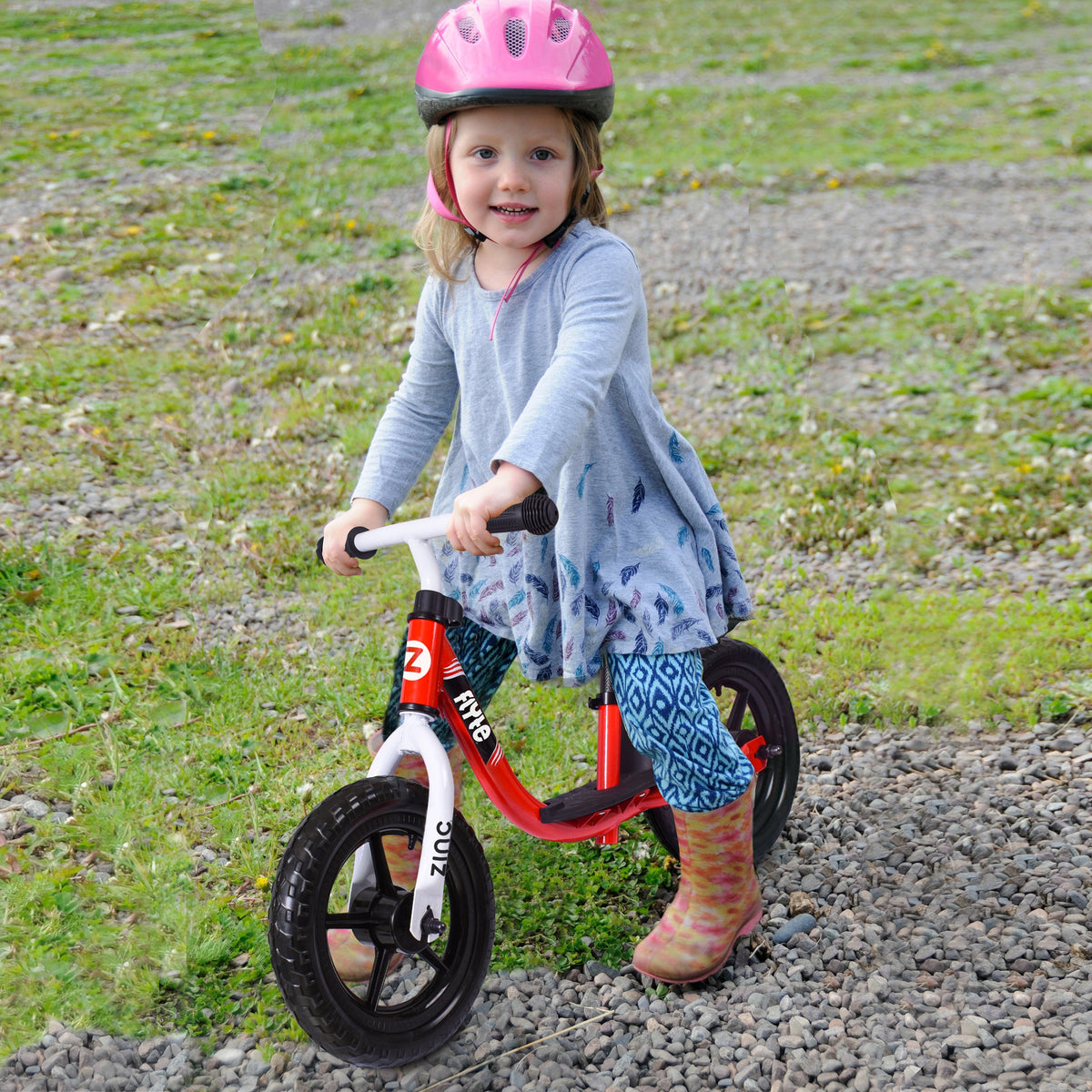 Young Girl Riding Zinc Flyte 12 Inch Dash Balance Bike - Pink Helmet Safety Gear for Ages 2+ Years