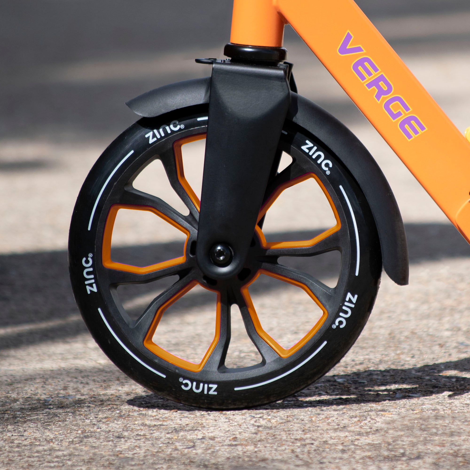 Close up of the ZINC verge scooter wheel in orange and black