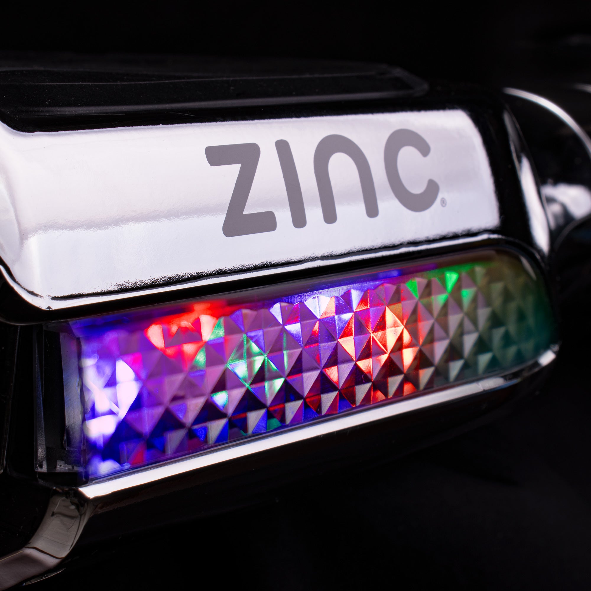 Bright colourful LED headlights on chrome hoverboard providing path illumination and style