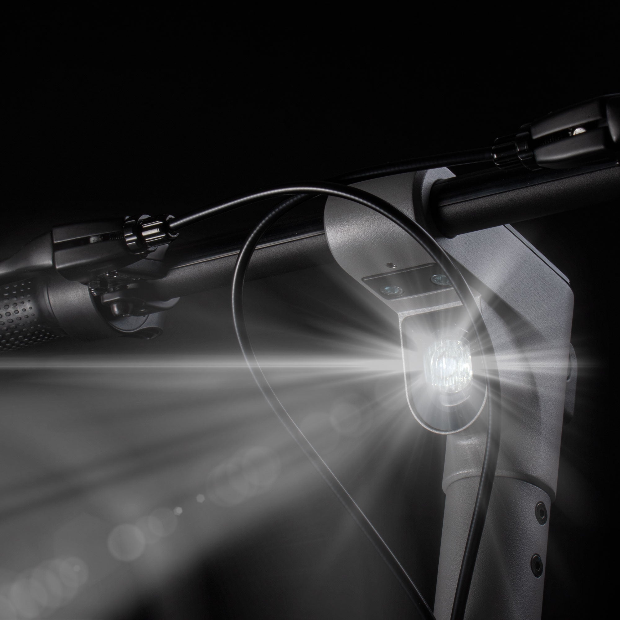 Zinc Velocity Plus electric scooter LED headlight close-up showing powerful front illumination for safe night riding